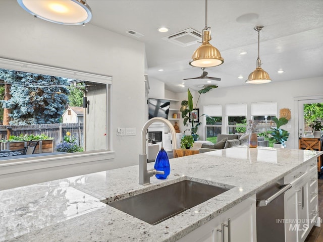 2510 N 24th St, Boise, ID 83702 - kitchen with white cabinetry, decorative light fixtures, light stone counters, and recessed lighting