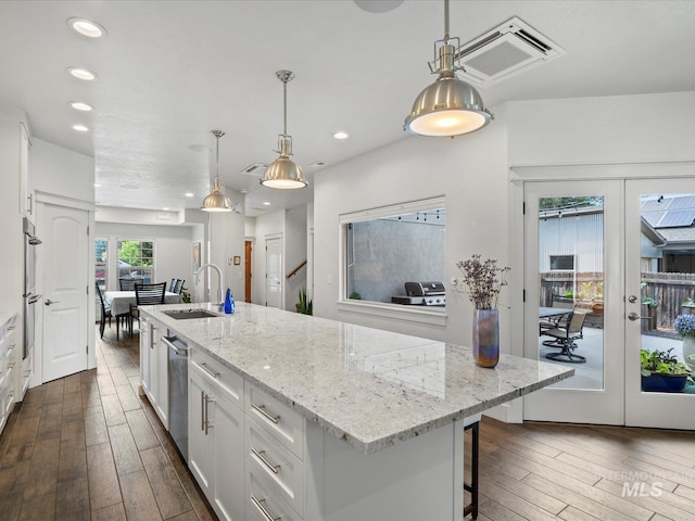 2510 N 24th St, Boise, ID 83702 - kitchen featuring french doors, dark wood finished floors, white cabinetry, a center island with sink, and recessed lighting