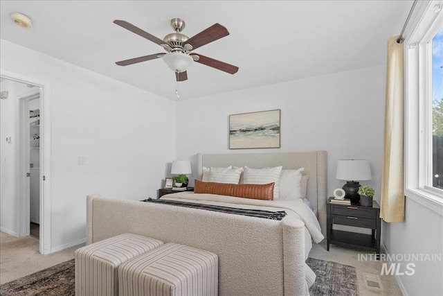 5692 S Flax Pl, Boise, ID 83716 - bedroom with carpet, multiple windows, baseboards, and ceiling fan