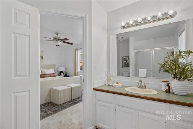 5692 S Flax Pl, Boise, ID 83716 - ensuite bathroom featuring vanity, a stall shower, and a ceiling fan