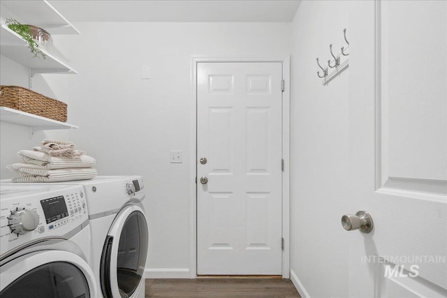 5692 S Flax Pl, Boise, ID 83716 - washroom featuring separate washer and dryer, wood finished floors, and baseboards