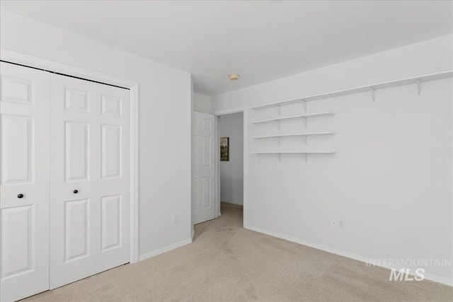 5692 S Flax Pl, Boise, ID 83716 - unfurnished bedroom featuring light colored carpet, baseboards, and a closet
