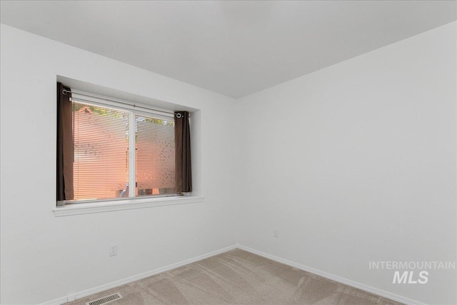5692 S Flax Pl, Boise, ID 83716 - spare room with baseboards and light carpet