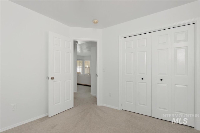 5692 S Flax Pl, Boise, ID 83716 - unfurnished bedroom with light carpet, a closet, and baseboards