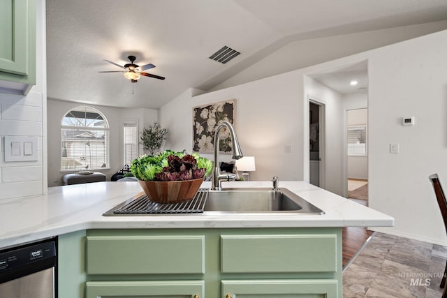 kitchen with vaulted ceiling, dishwasher, green cabinets, kitchen peninsula, and ceiling fan