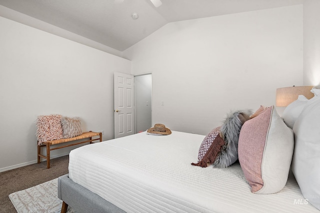 carpeted bedroom featuring lofted ceiling and ceiling fan