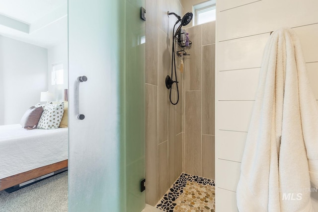 bathroom with a tile shower