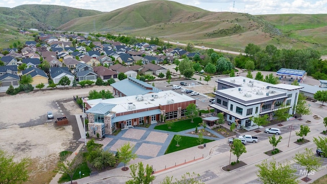 birds eye view of property with a mountain view