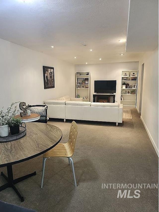297 N 4228 E, Rigby, ID 83442 - carpeted living room featuring built in shelves and recessed lighting