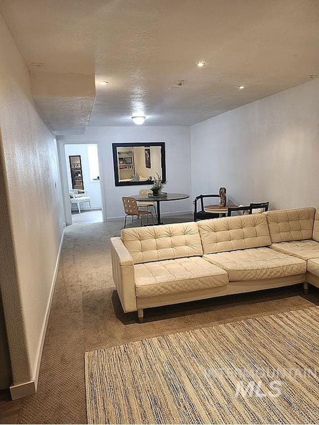 297 N 4228 E, Rigby, ID 83442 - carpeted living area with baseboards and recessed lighting