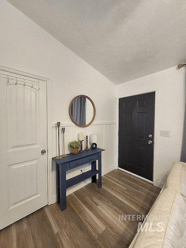297 N 4228 E, Rigby, ID 83442 - entryway with vaulted ceiling, wood finished floors, and a textured ceiling