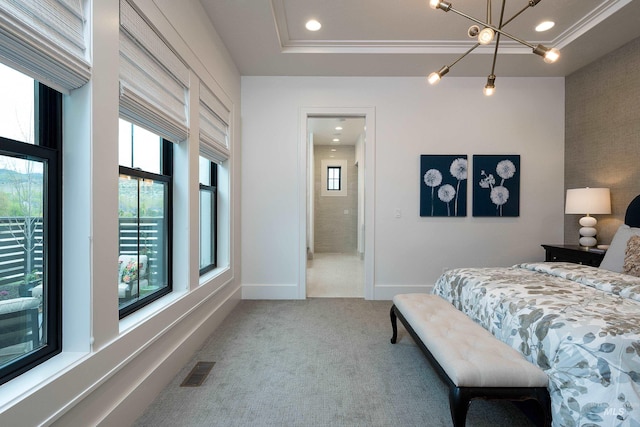 bedroom featuring light colored carpet, a notable chandelier, a raised ceiling, and multiple windows