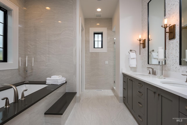 bathroom with vanity and plus walk in shower