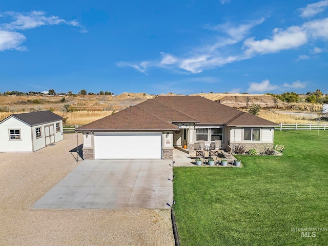 ranch-style house with a front lawn and a garage