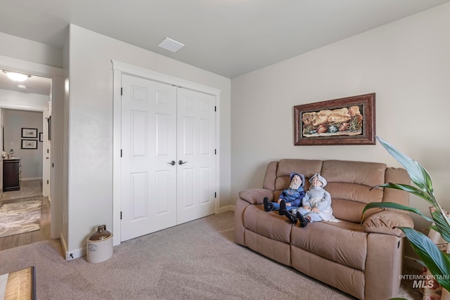 living room with light colored carpet