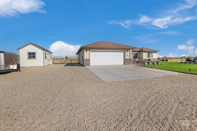 view of front of property with a front lawn and a garage