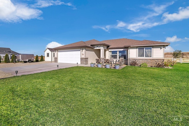 view of front of home with a garage and a front lawn