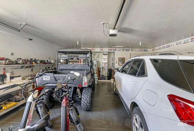 garage with a garage door opener and water heater