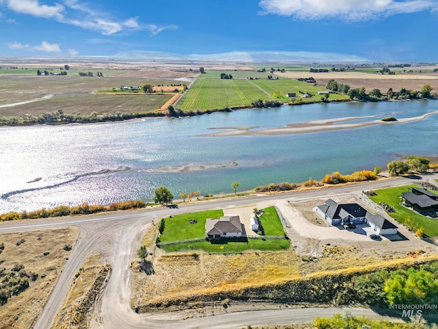 drone / aerial view with a water view and a rural view