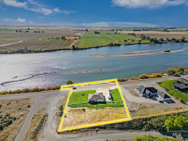 aerial view with a water view and a rural view