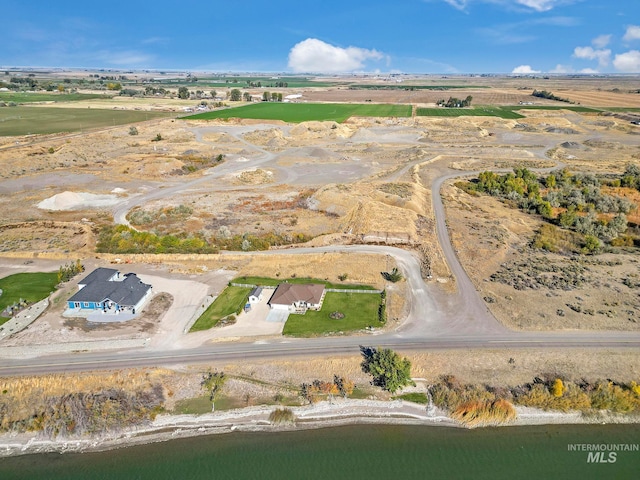 bird's eye view with a rural view and a water view