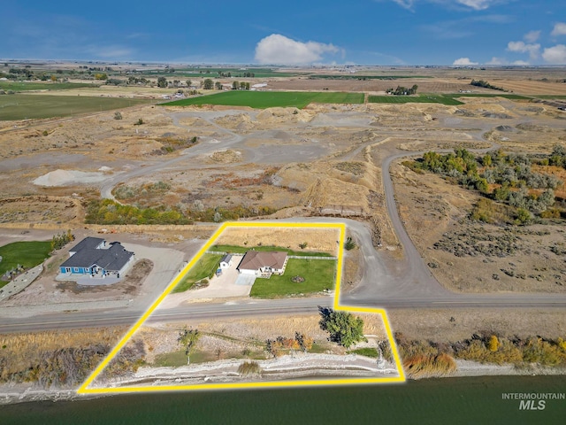 birds eye view of property with a rural view