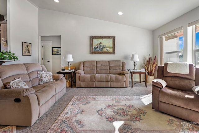 living room with light carpet and lofted ceiling