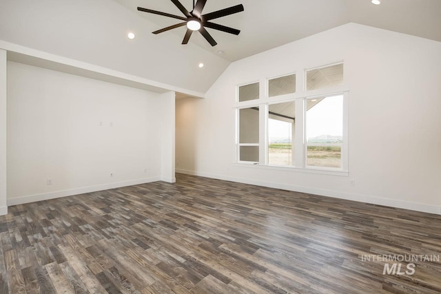 unfurnished living room featuring vaulted ceiling, dark hardwood / wood-style flooring, and ceiling fan