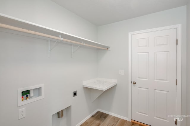 laundry room featuring hookup for an electric dryer, washer hookup, and light wood-type flooring