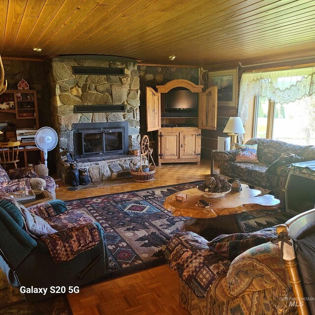 1050 Maxwell Ln, Elk City, ID 83525 - living room featuring wooden ceiling, rustic walls, and a fireplace