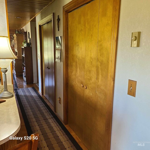 1050 Maxwell Ln, Elk City, ID 83525 - corridor featuring wooden ceiling and carpet flooring