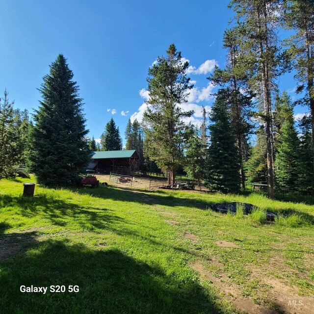 1050 Maxwell Ln, Elk City, ID 83525 - view of front facade featuring an exterior structure, an outbuilding, and metal roof