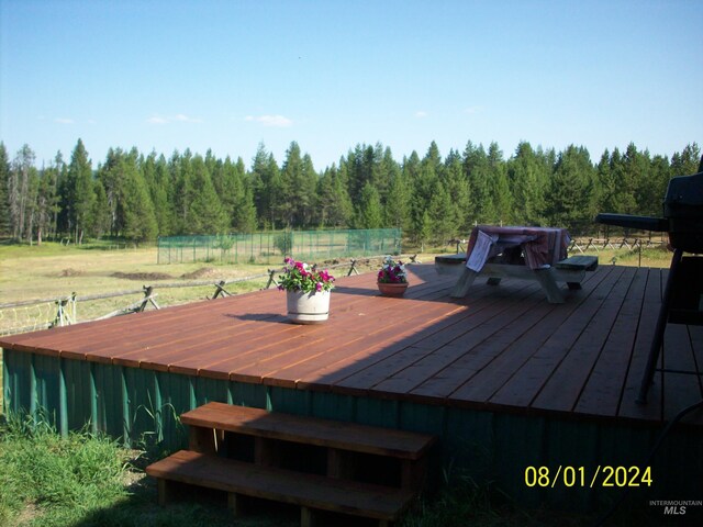 1050 Maxwell Ln, Elk City, ID 83525 - view of side of property featuring log siding, a lawn, a chimney, and metal roof