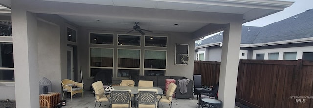 view of patio featuring ceiling fan