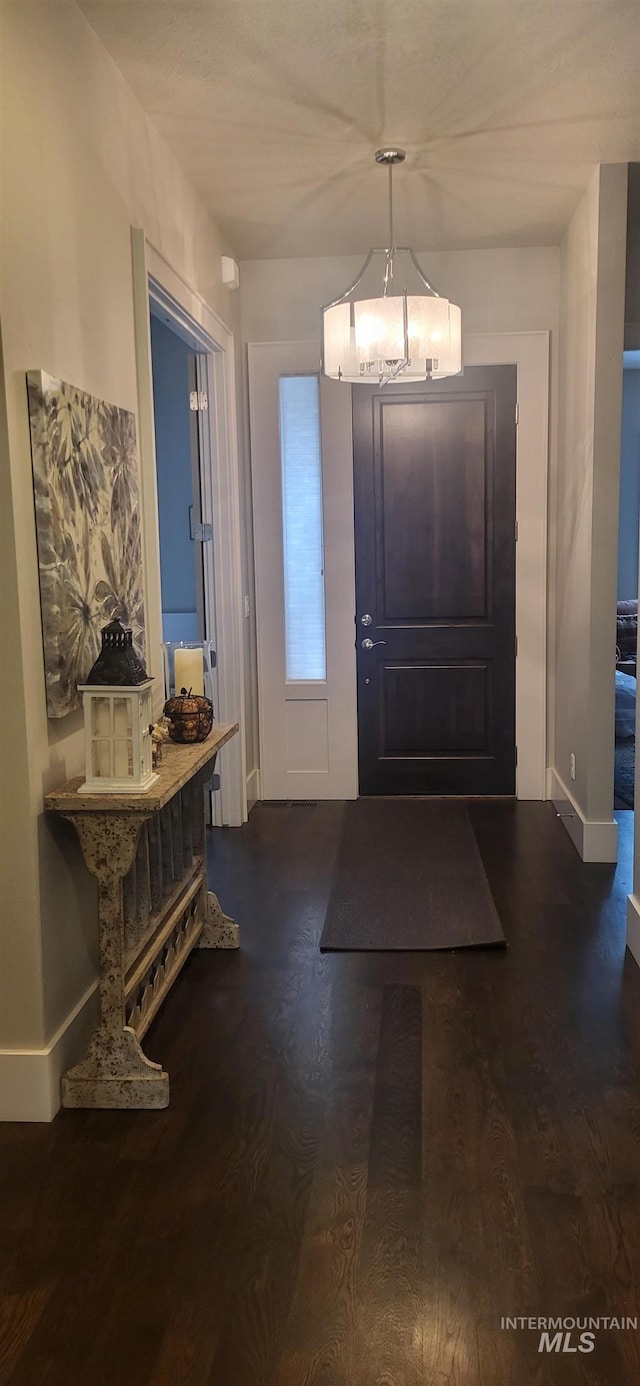 entryway featuring dark wood-type flooring