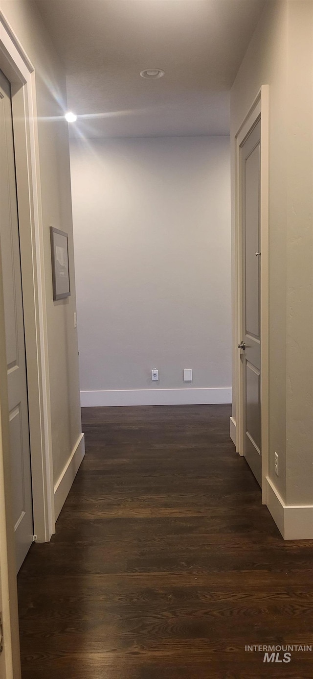 hallway featuring dark hardwood / wood-style floors