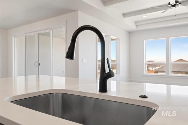 room details with recessed lighting, a ceiling fan, a sink, and light countertops