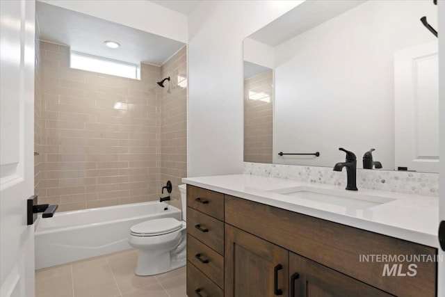 full bath with tile patterned floors, tub / shower combination, vanity, and toilet