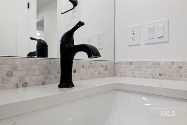 interior details with a sink and tasteful backsplash