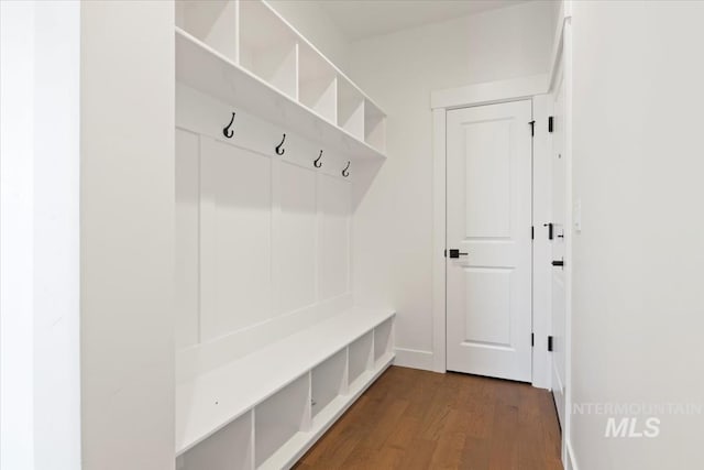 mudroom with baseboards and dark wood-style floors