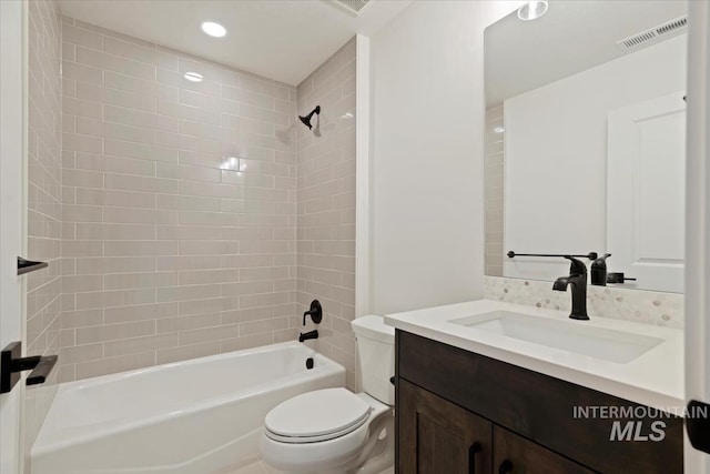 bathroom featuring washtub / shower combination, recessed lighting, visible vents, toilet, and vanity