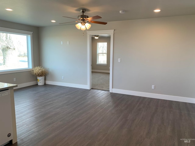 spare room featuring ceiling fan and dark hardwood / wood-style floors