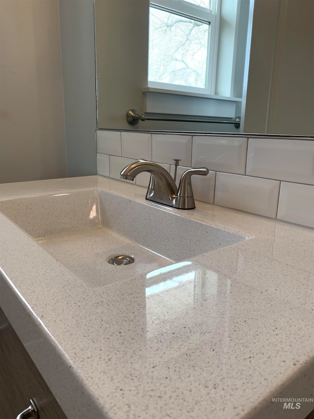 interior details with backsplash and sink