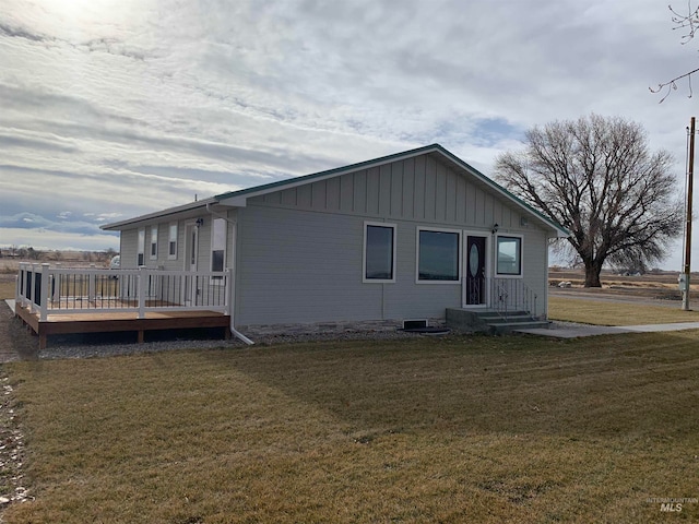 exterior space with a lawn and a deck