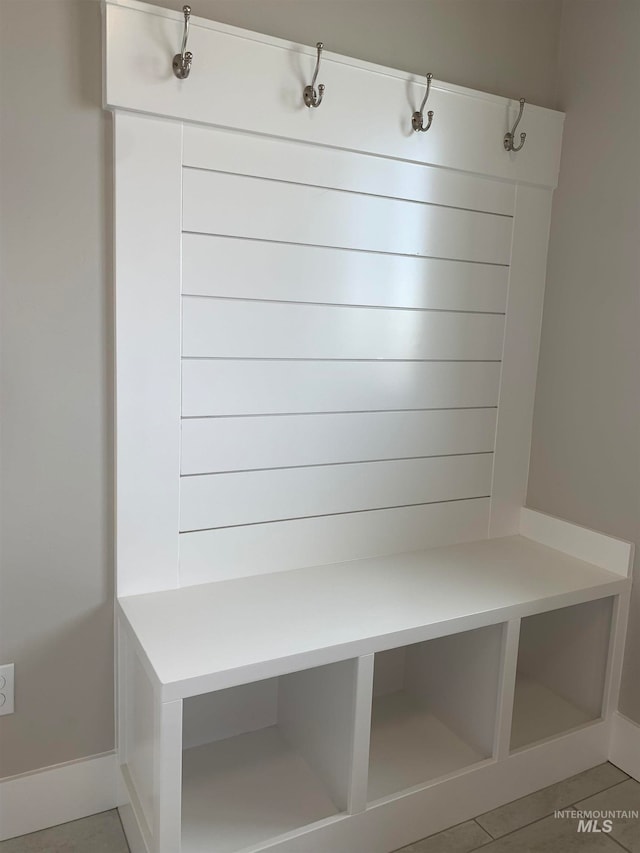 mudroom featuring light tile floors