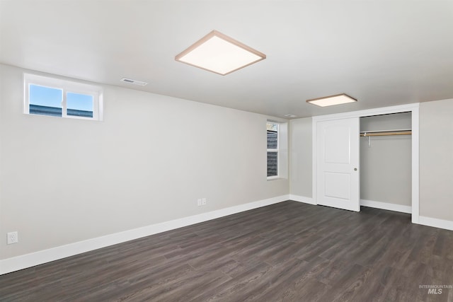 basement featuring dark hardwood / wood-style floors