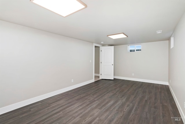 spare room featuring dark hardwood / wood-style flooring