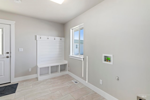 mudroom featuring light tile floors