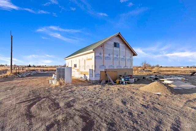 rear view of house with a rural view