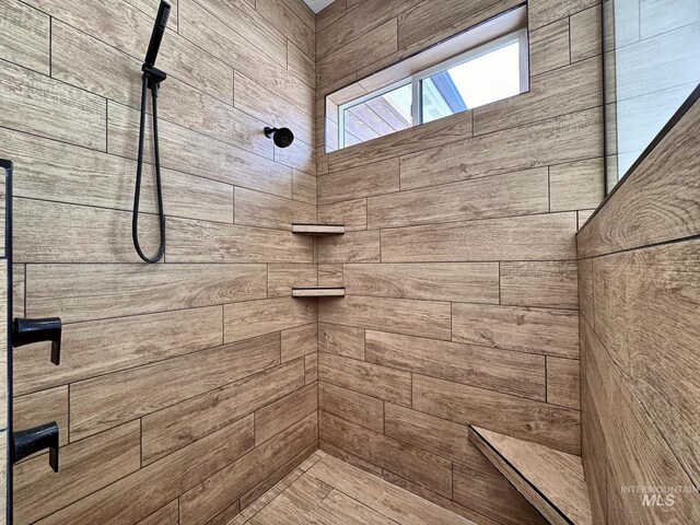 full bathroom with tiled shower